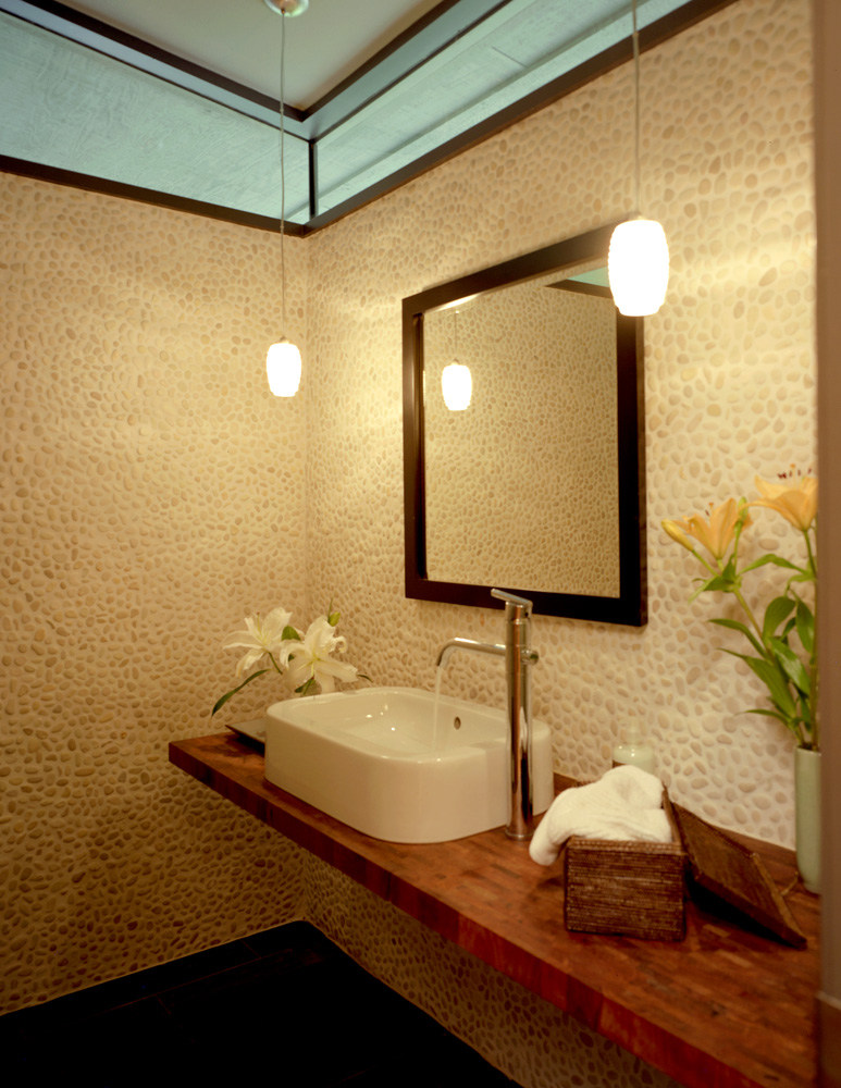 A bathroom with tiled wall.