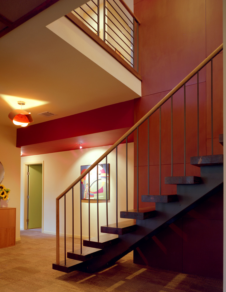 Stairs leading to first floor through. opening.