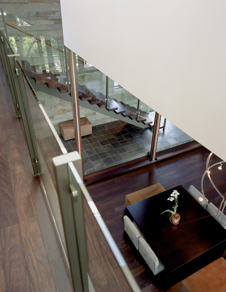 View of dining table from interior balcony above.