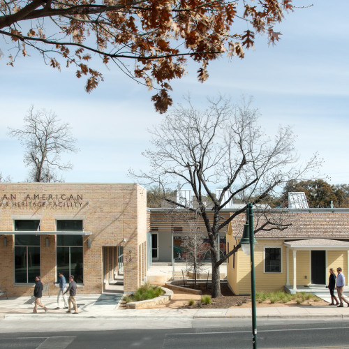 A small house next to a building titled "African American Cultural & Heritage Facility".