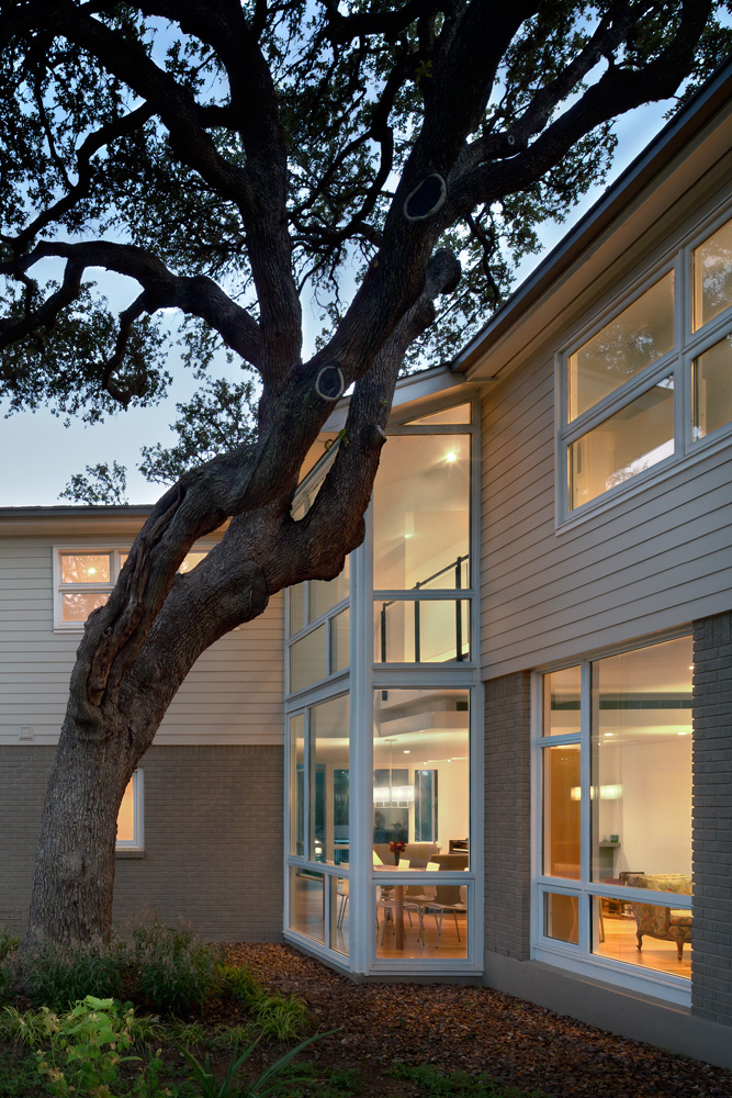 A dining room visible through window to backyard.