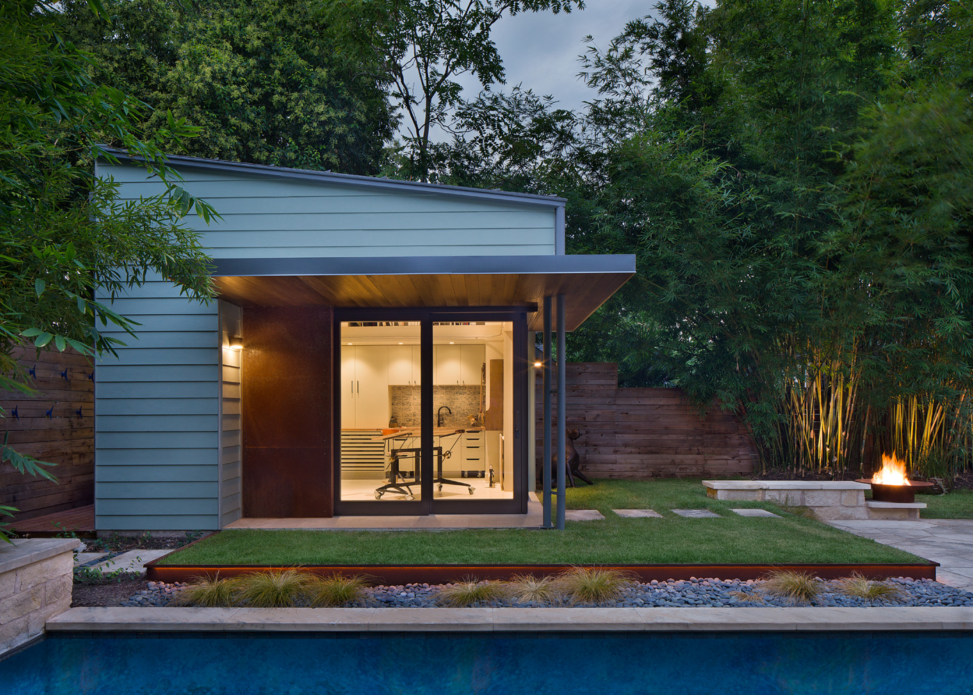 View of backyard art studio from across the neighboring pool.