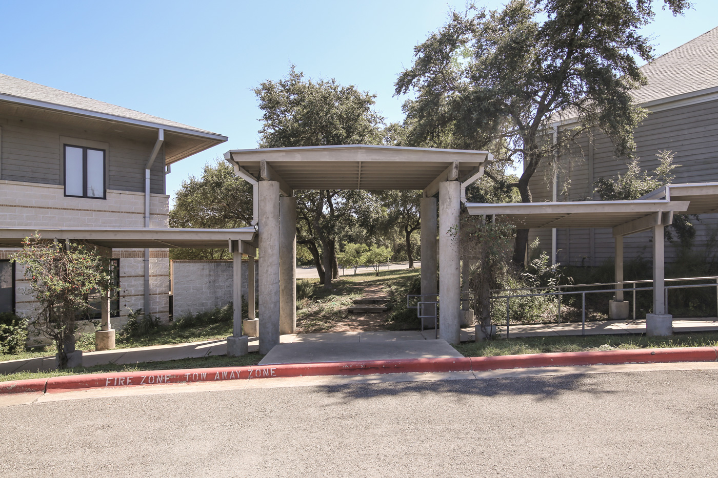 Curb leading to and accessible ramp and its awning.