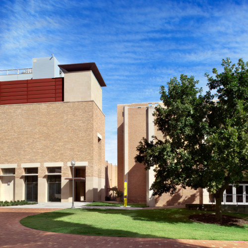 Exterior courtyard and walkways of university campus buildings.