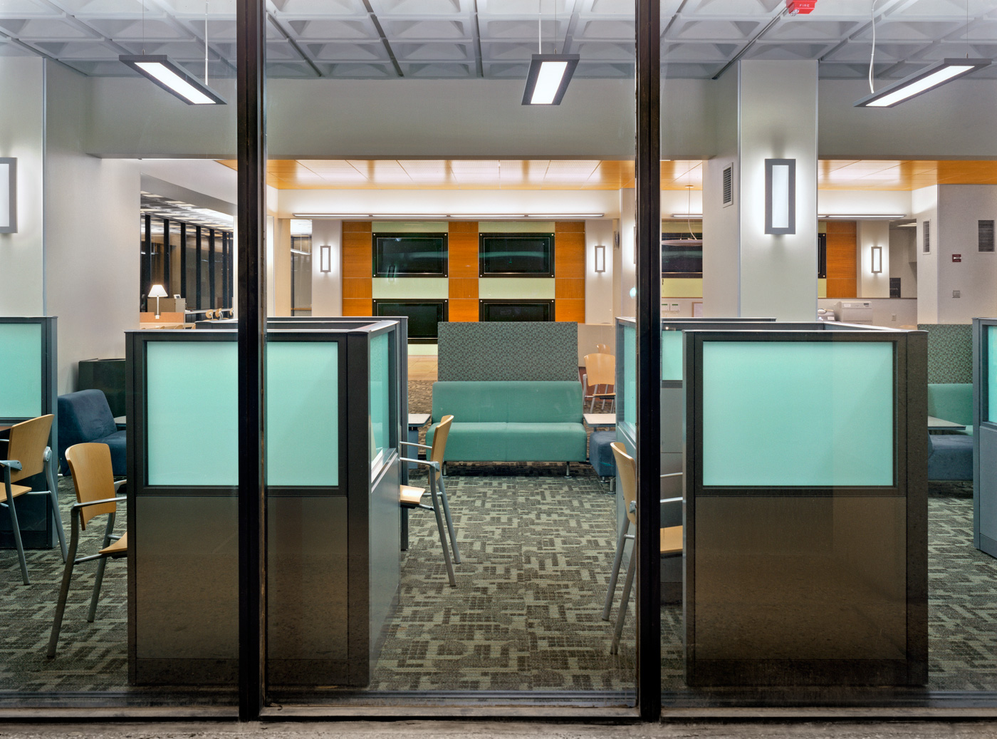 A large study lounge visible through large exterior windows.