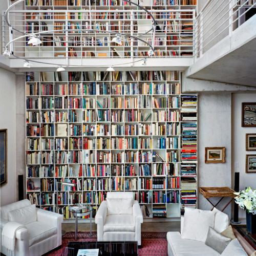 Large two floor bookcase in a home.