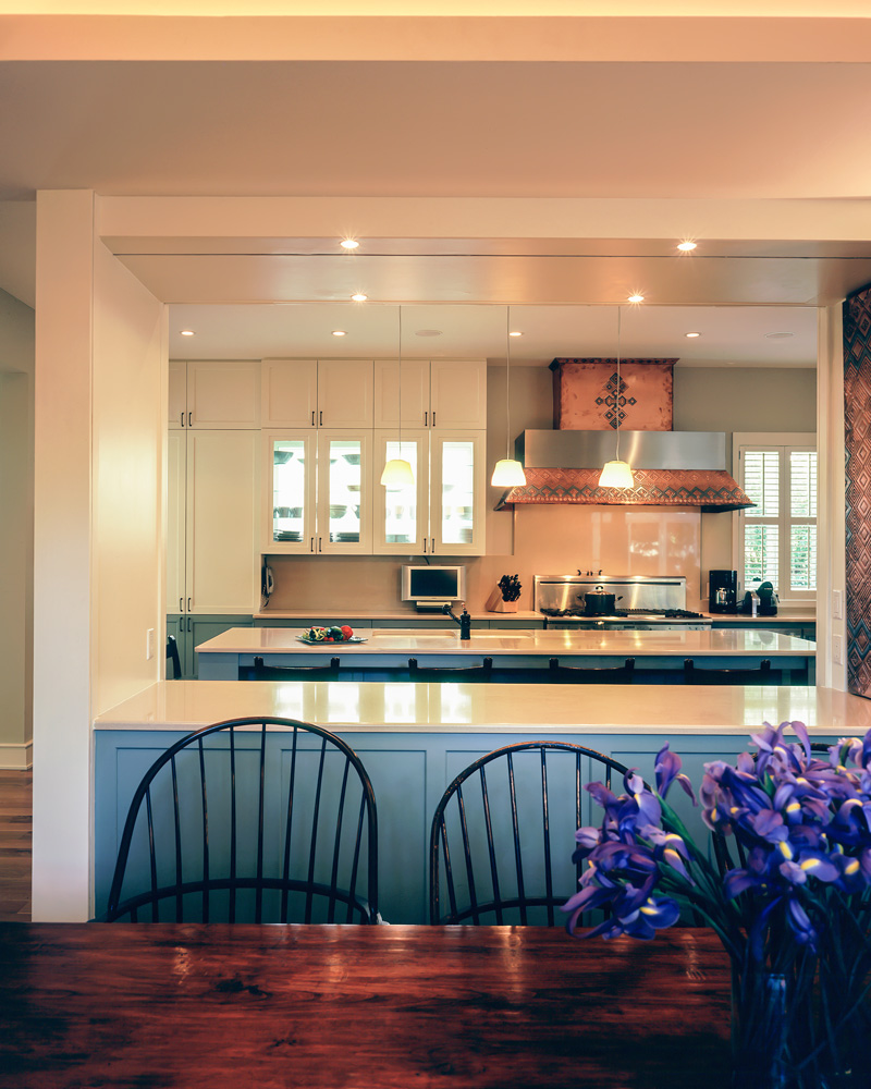 A dining room and nearby kitchen.
