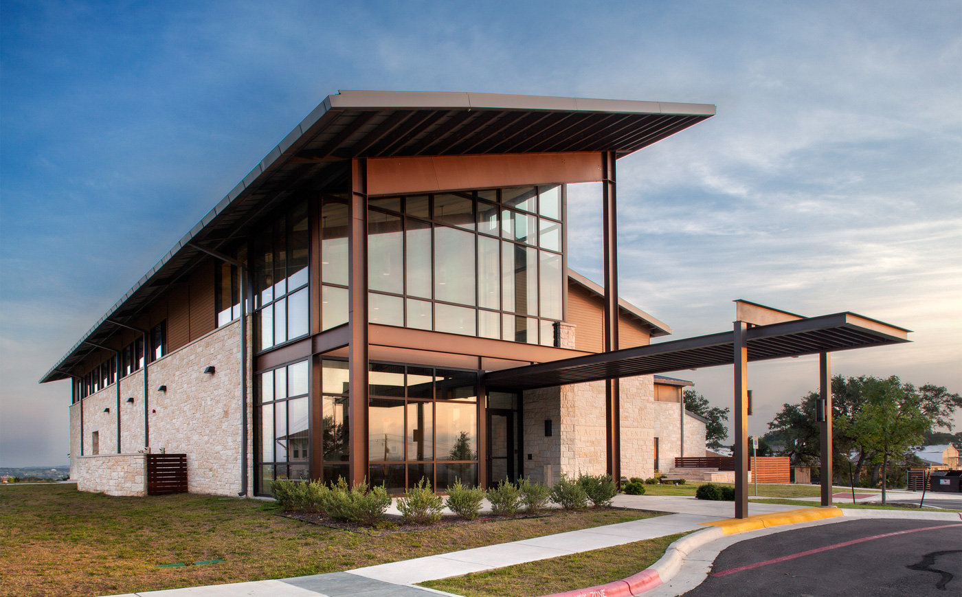 The metal and glass main entrance of a building.