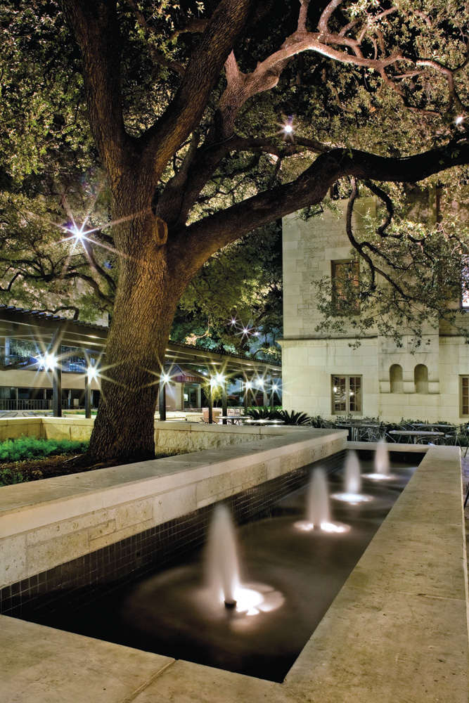 A small exterior fountain shooting up water.