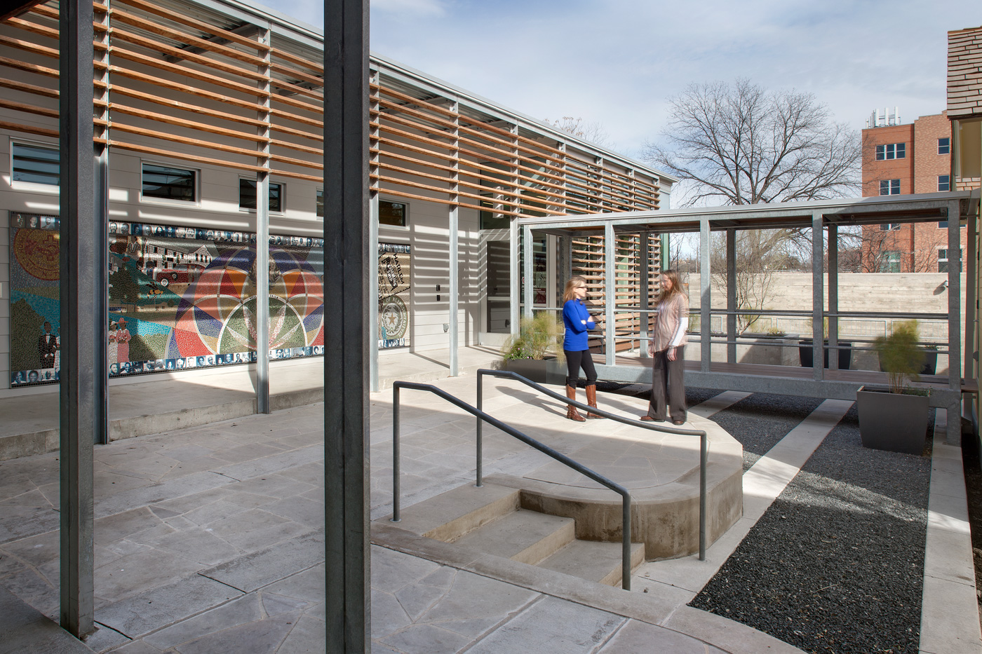 People standing on the concrete patio above a central courtyard.