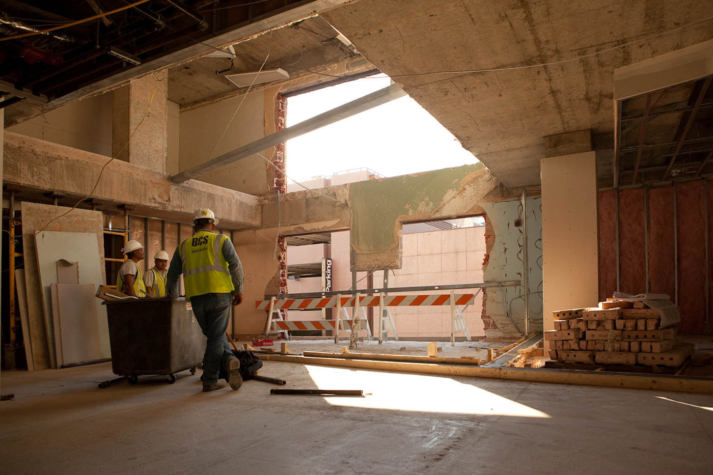 Workers standing in a construction site.