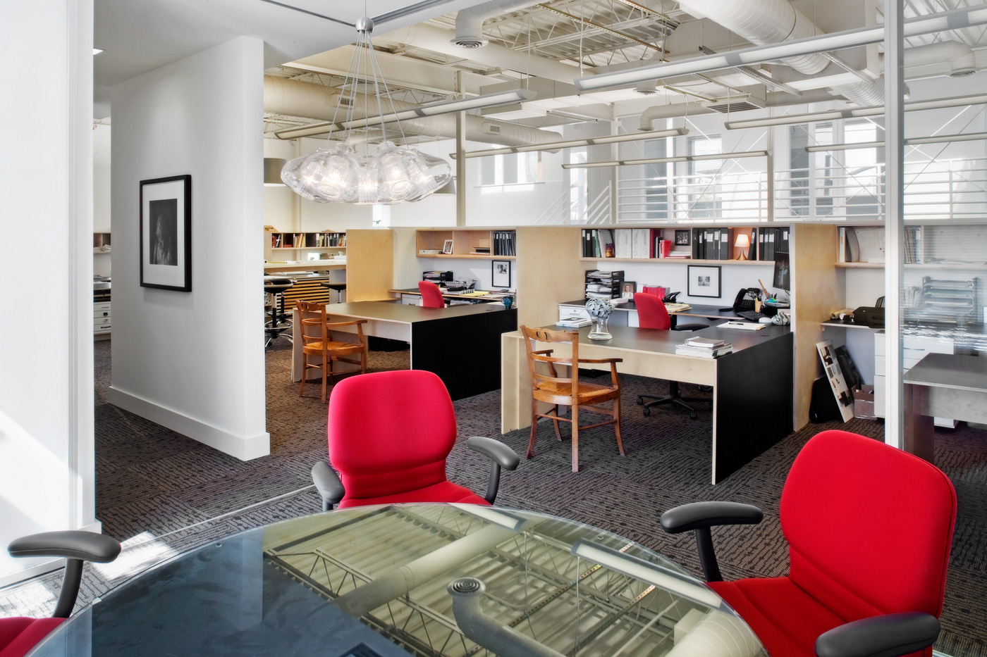 Small conference table near cubicles.