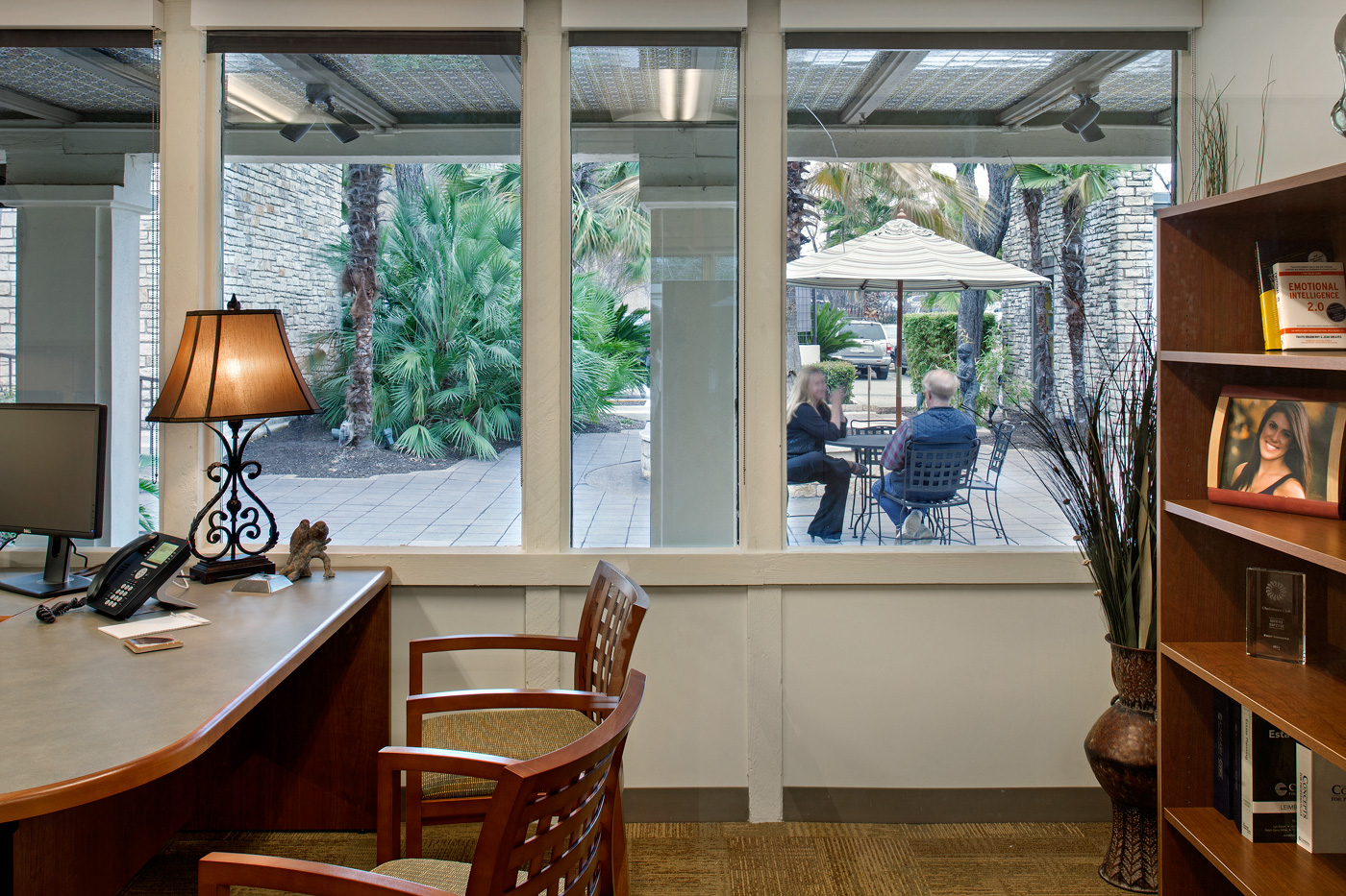 View of a patio area from a private office's windows.