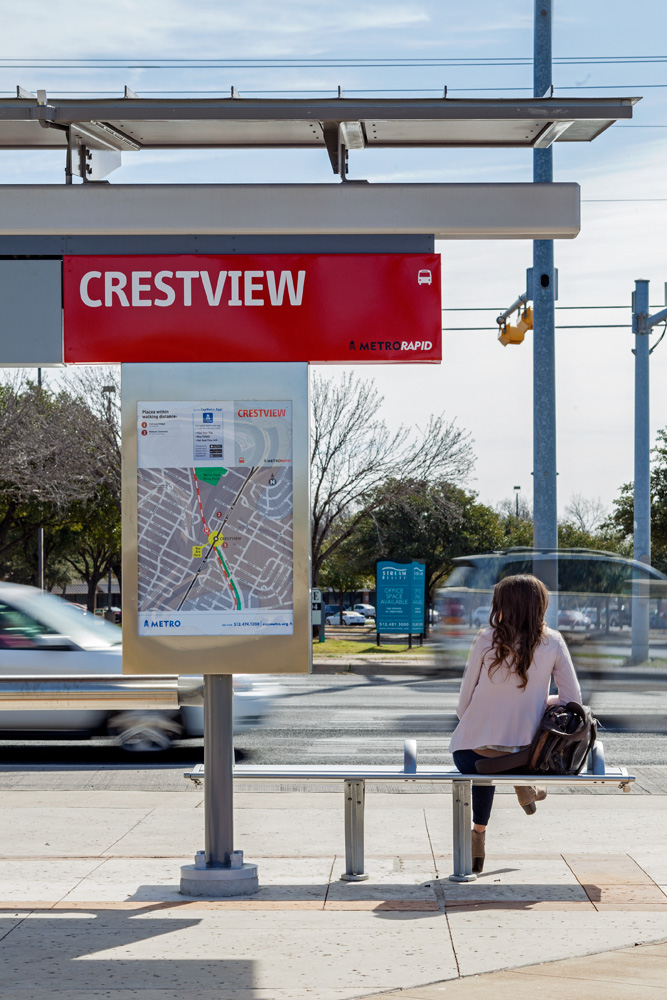 A woman waiting for the bus at the 