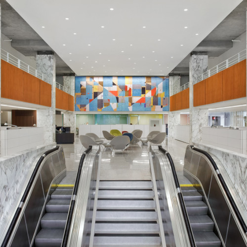 Escalators leading up to center of office building.