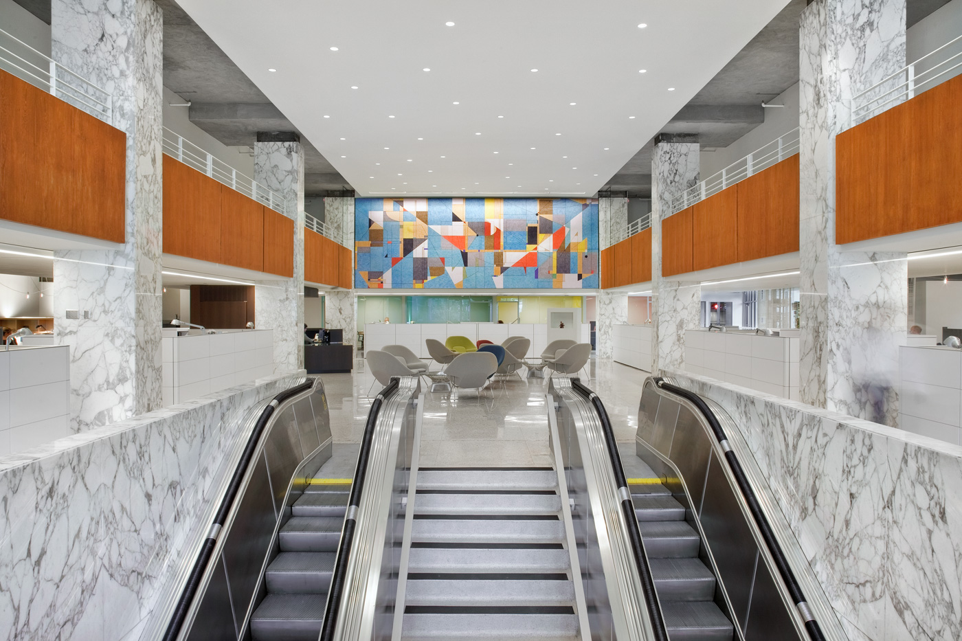 Escalators leading up to center of office building.