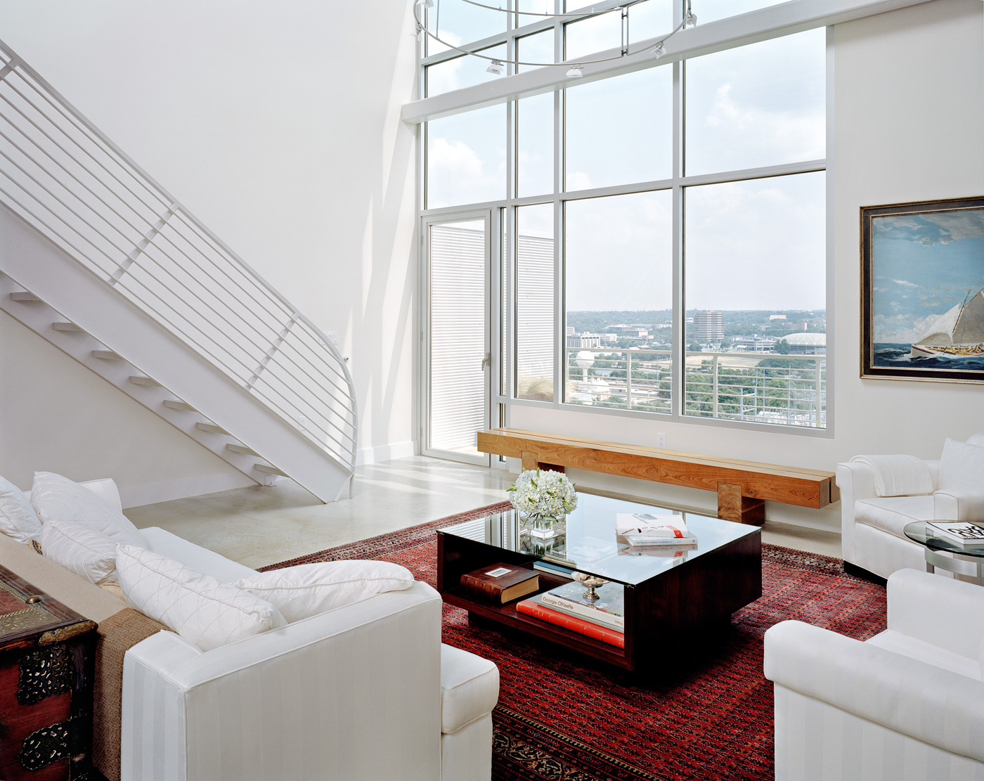 A white living room of a downtown Austin apartment.
