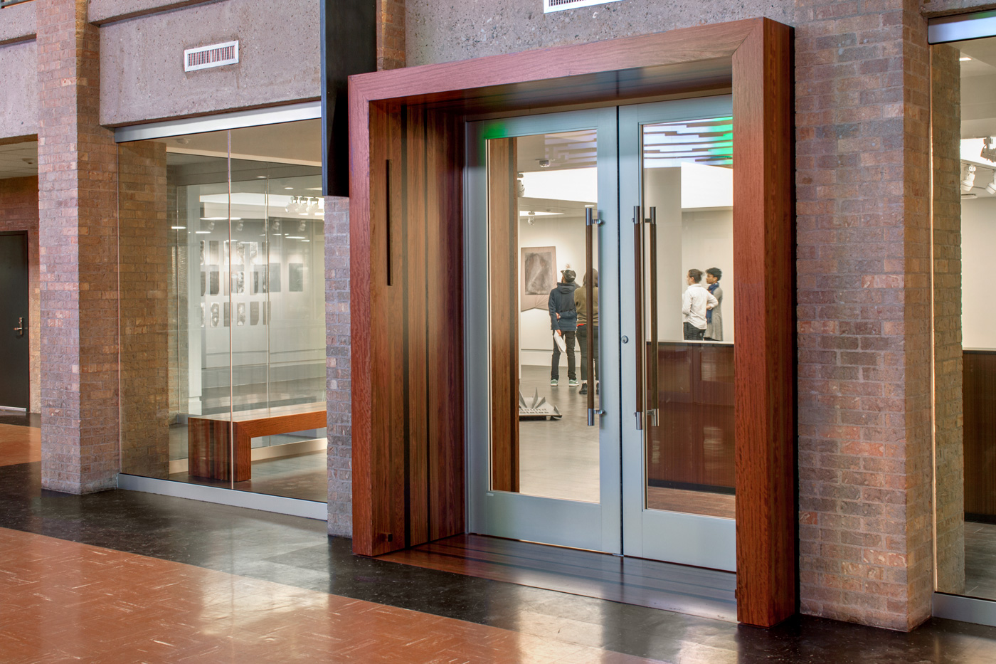 large glass double doors leading into an art exhibit.