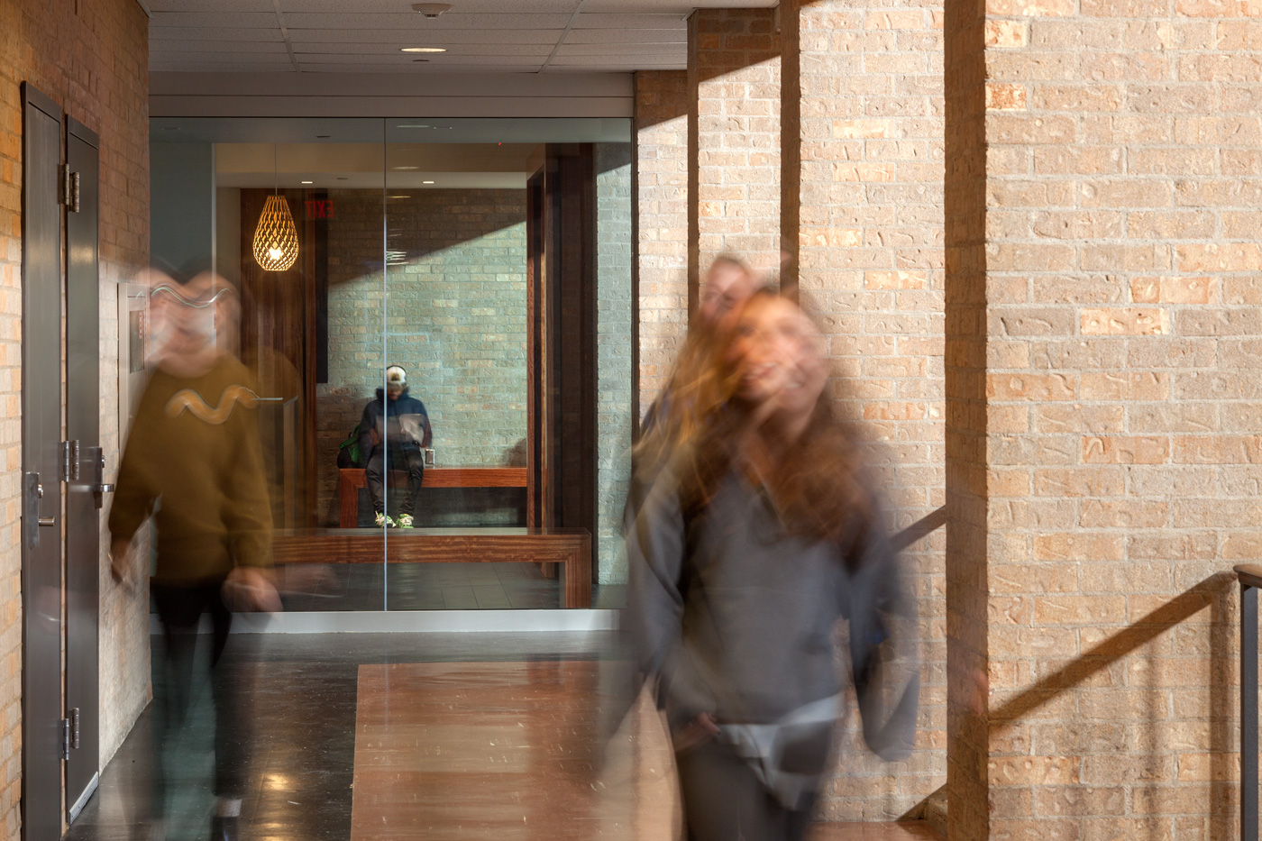 Students walking down a hallway.