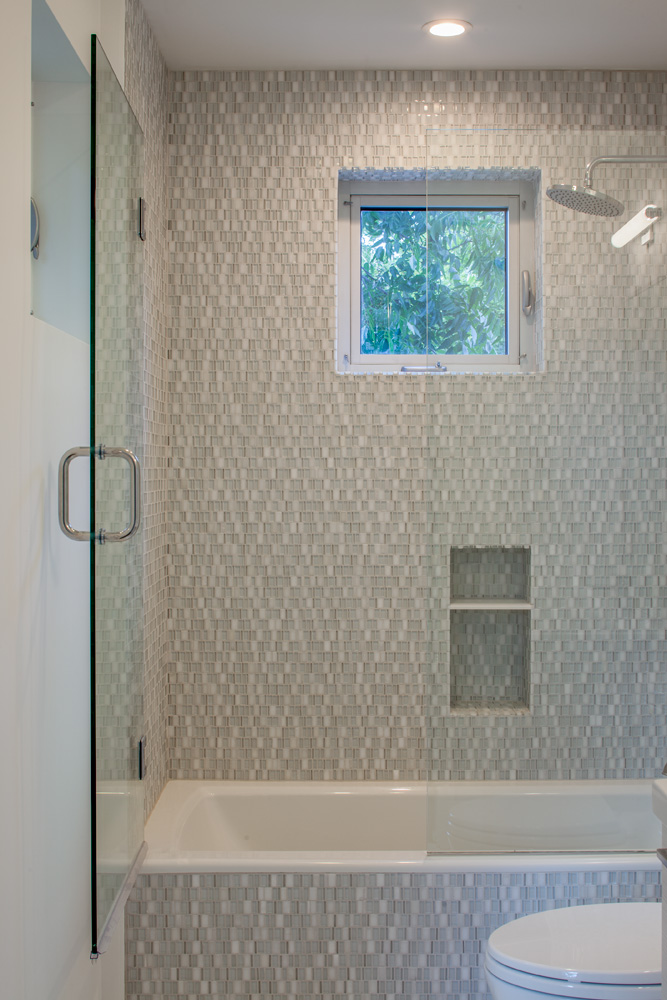 A tiled glass shower.