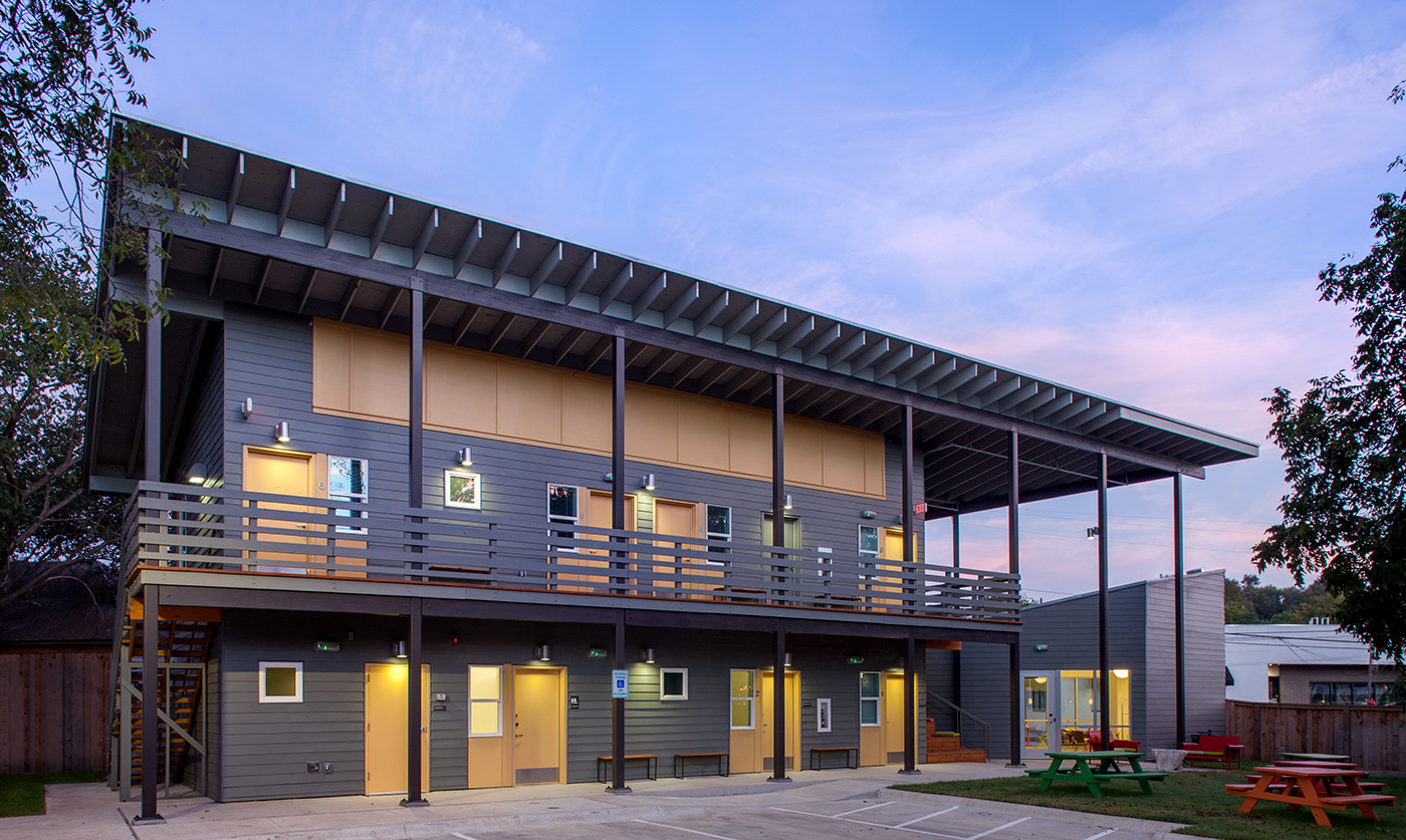 A hostel and its exterior courtyard.