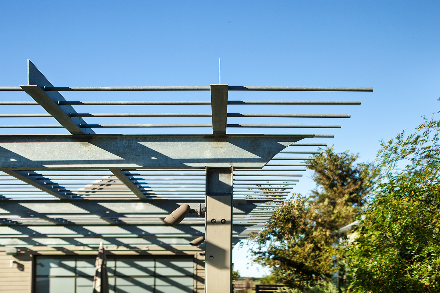 The detail of a metal pool awning.