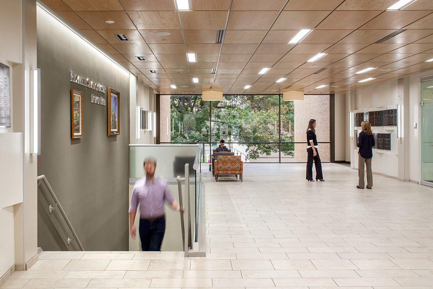 People in a college building's interior.