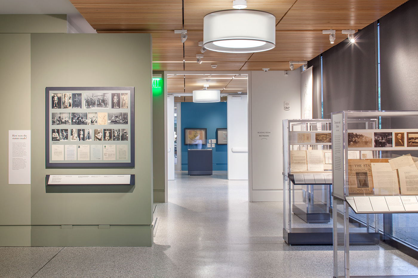 An exhibit hallway with display cases off to its side.