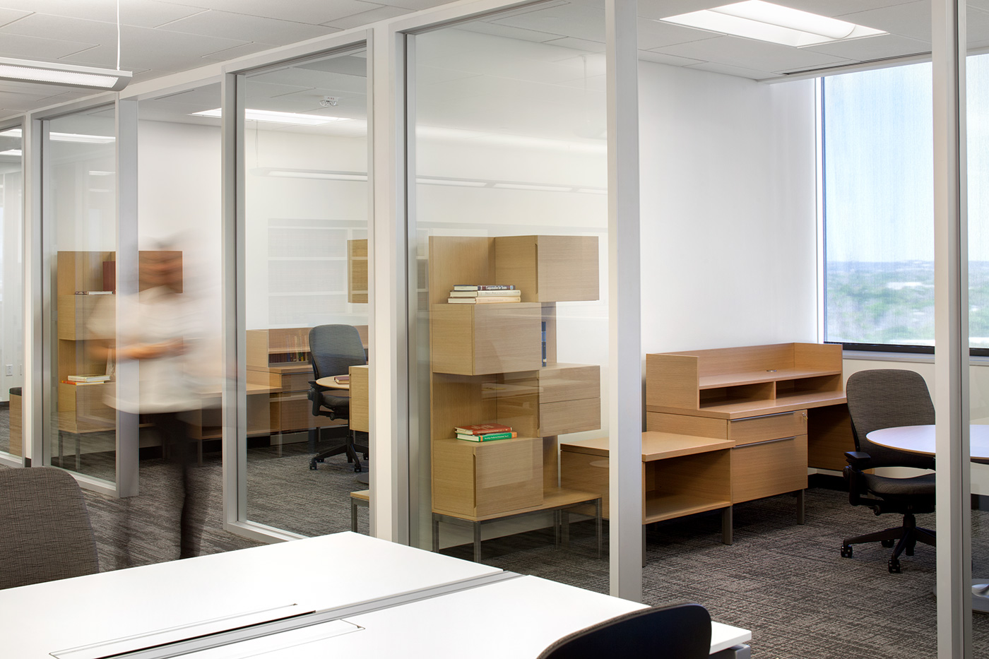 Private offices with desks and cabinets.