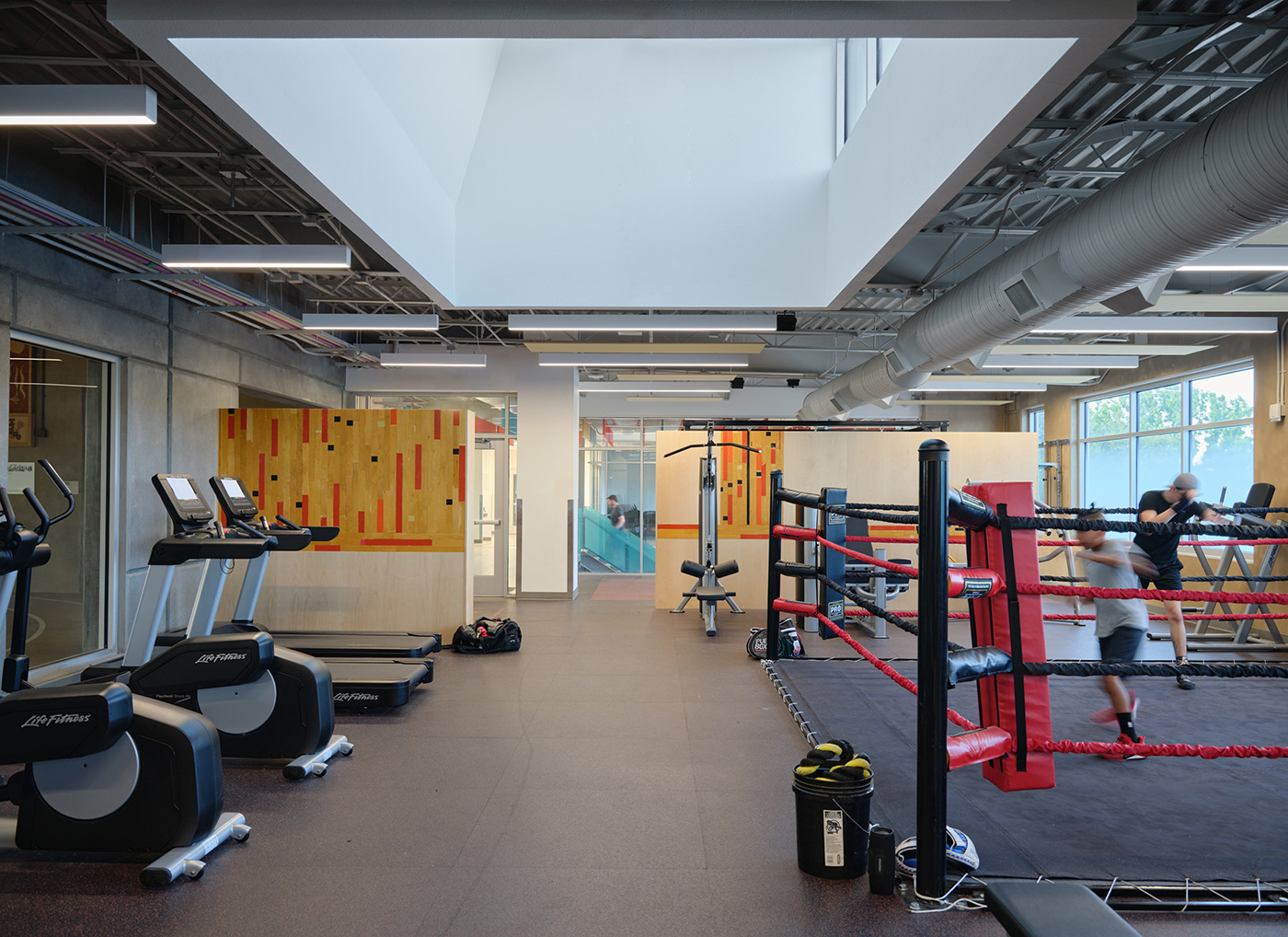 People boxing in a workout room