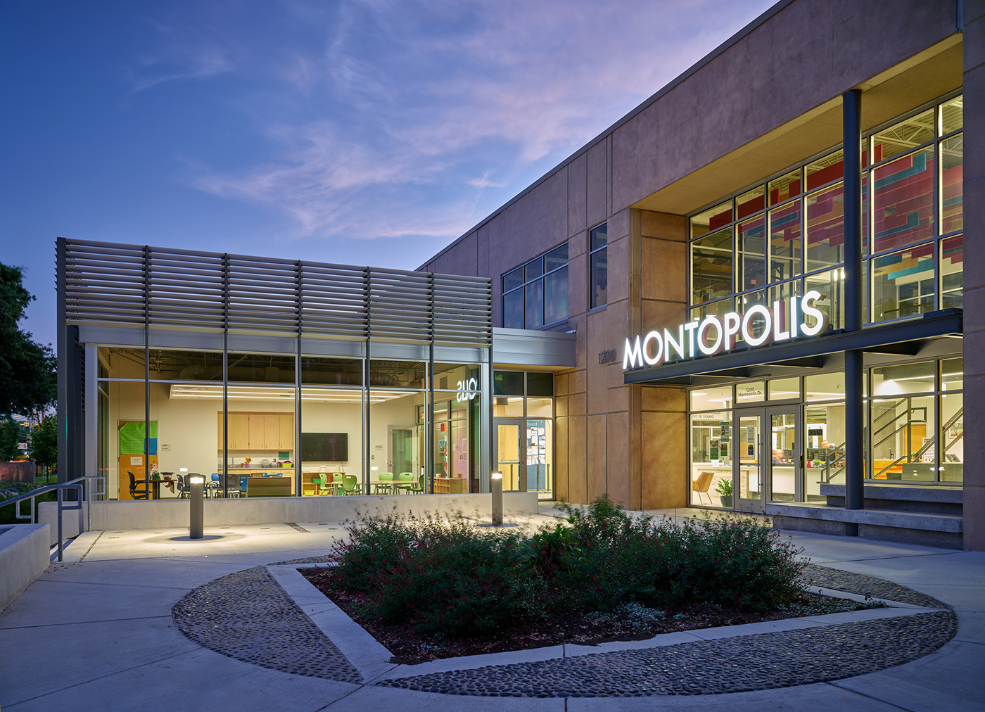 front of large building that is adorned in bright lettering that reads 