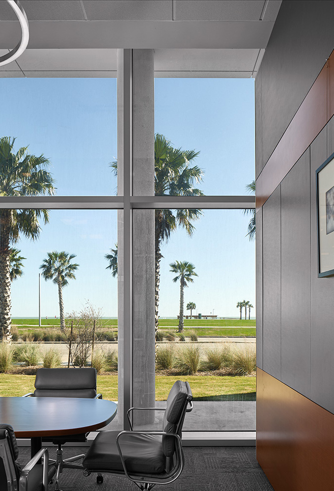 A conference rooms view of the beach.