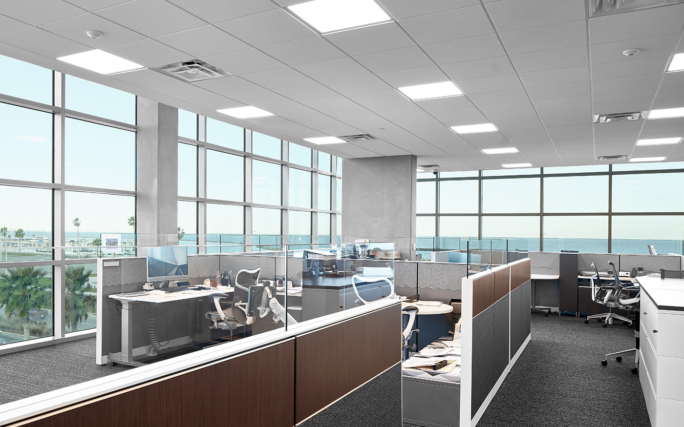 Modern office cubicles with a view of the ocean.