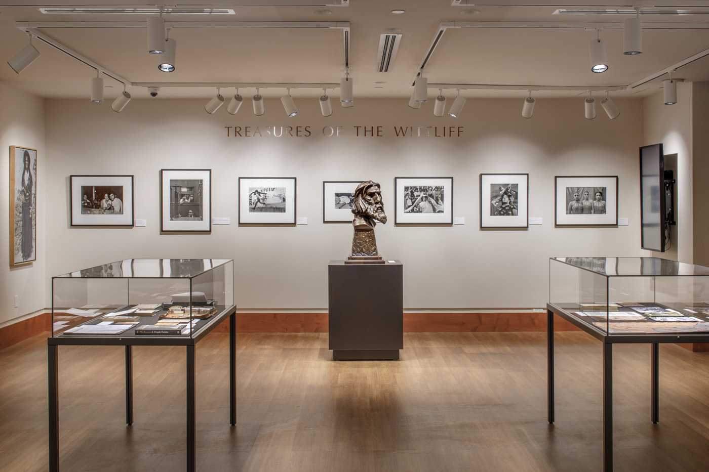 Photographs, display cases and, a bust in exabit titled 