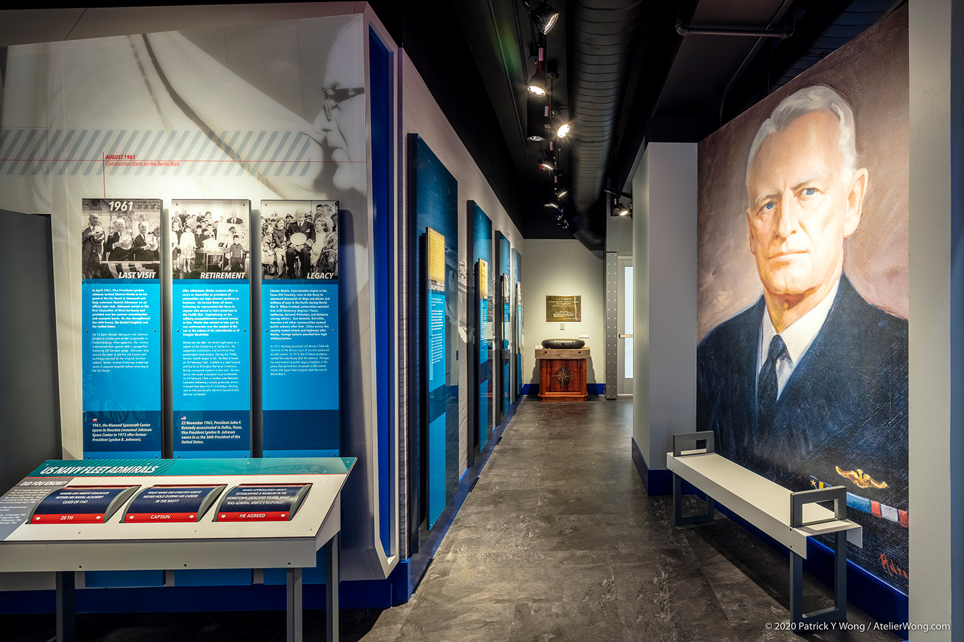 A museum hallway with plaques and displays.