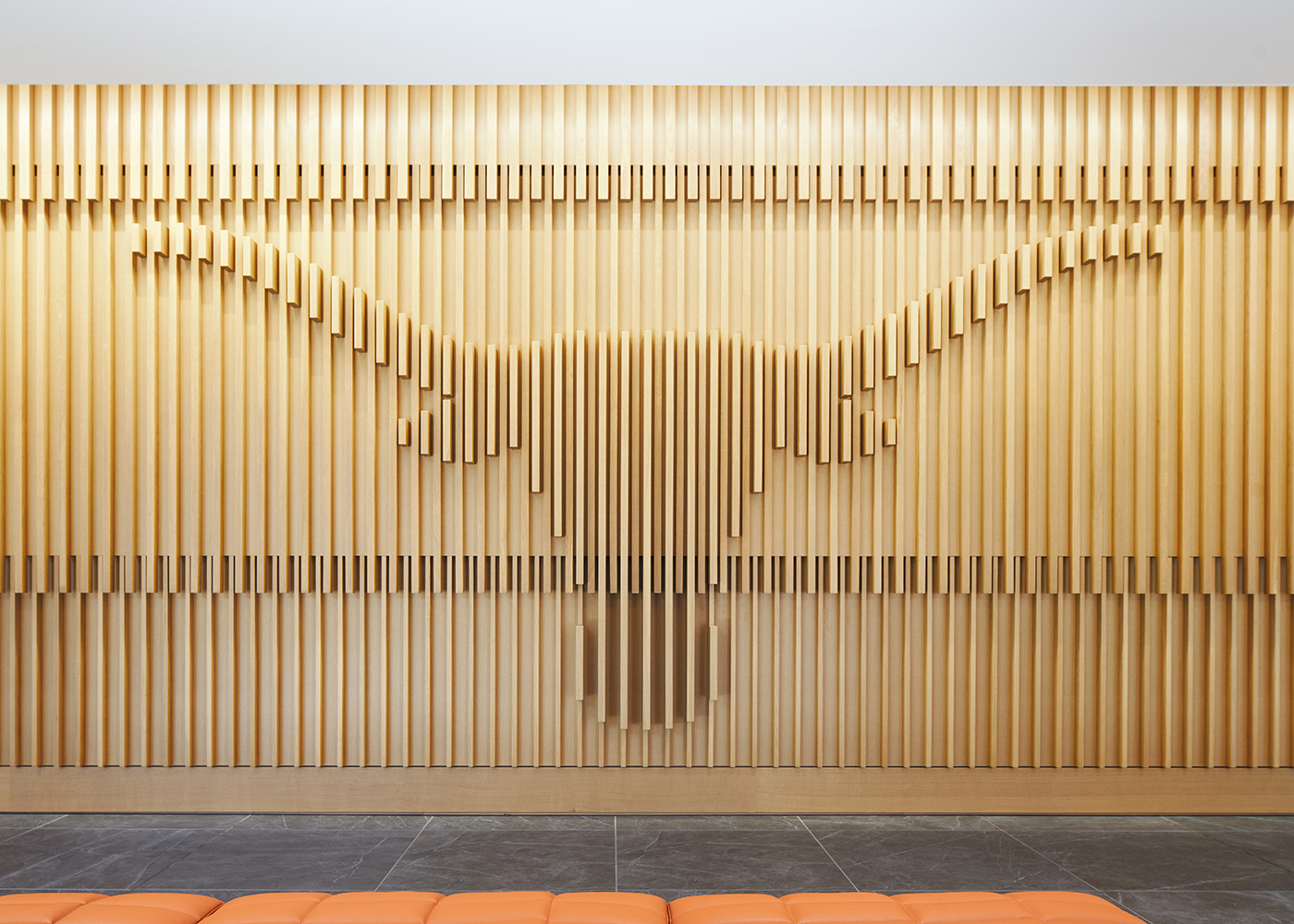 A long horn symbol designed into a wooden wall.