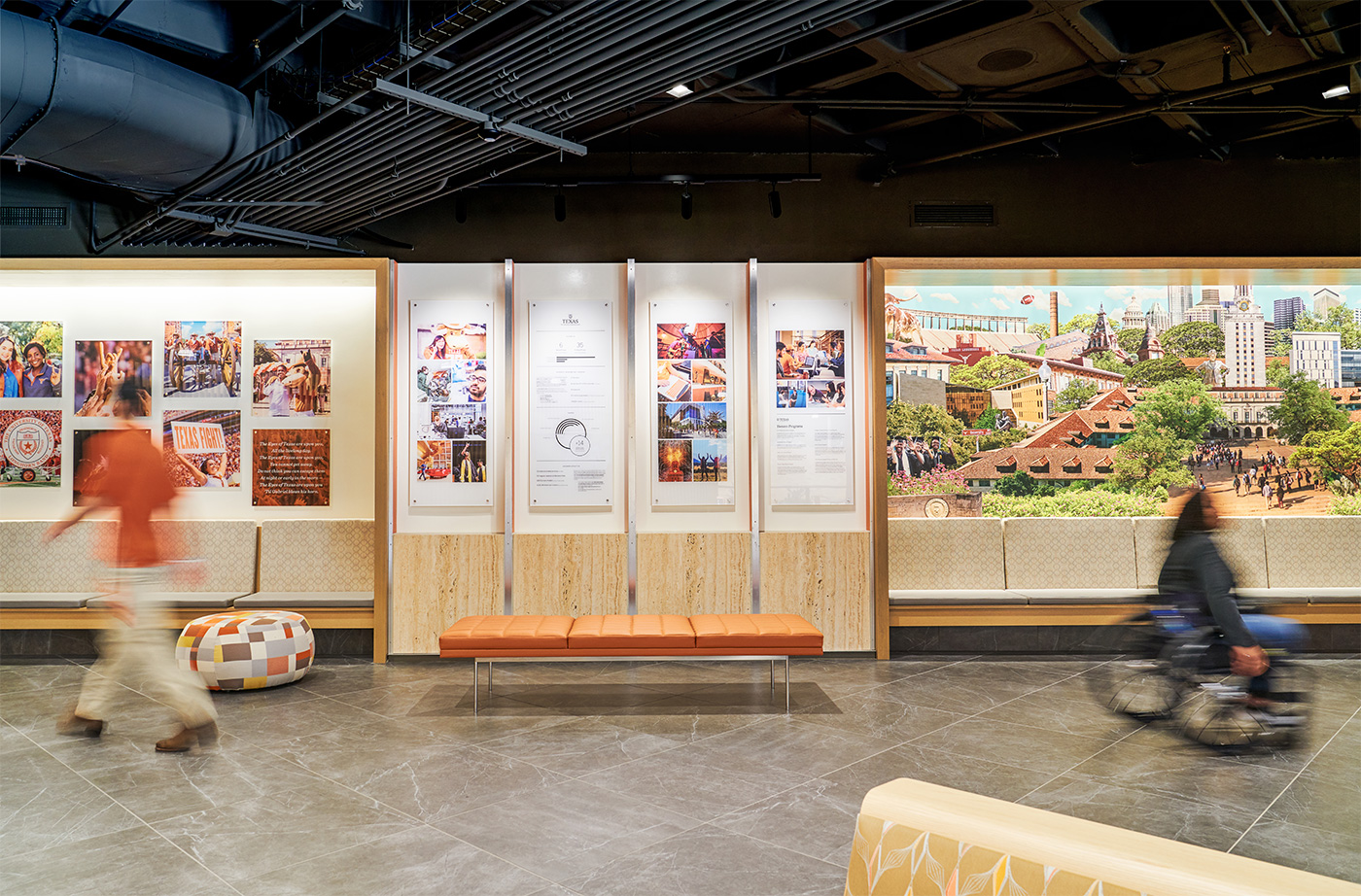 Information, a mural, and benches against wall.