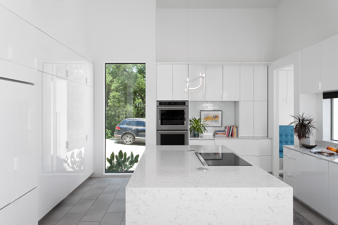 White kitchen with new sleek appliances.