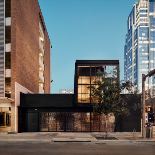 Black exteriors of two floors building downtown.