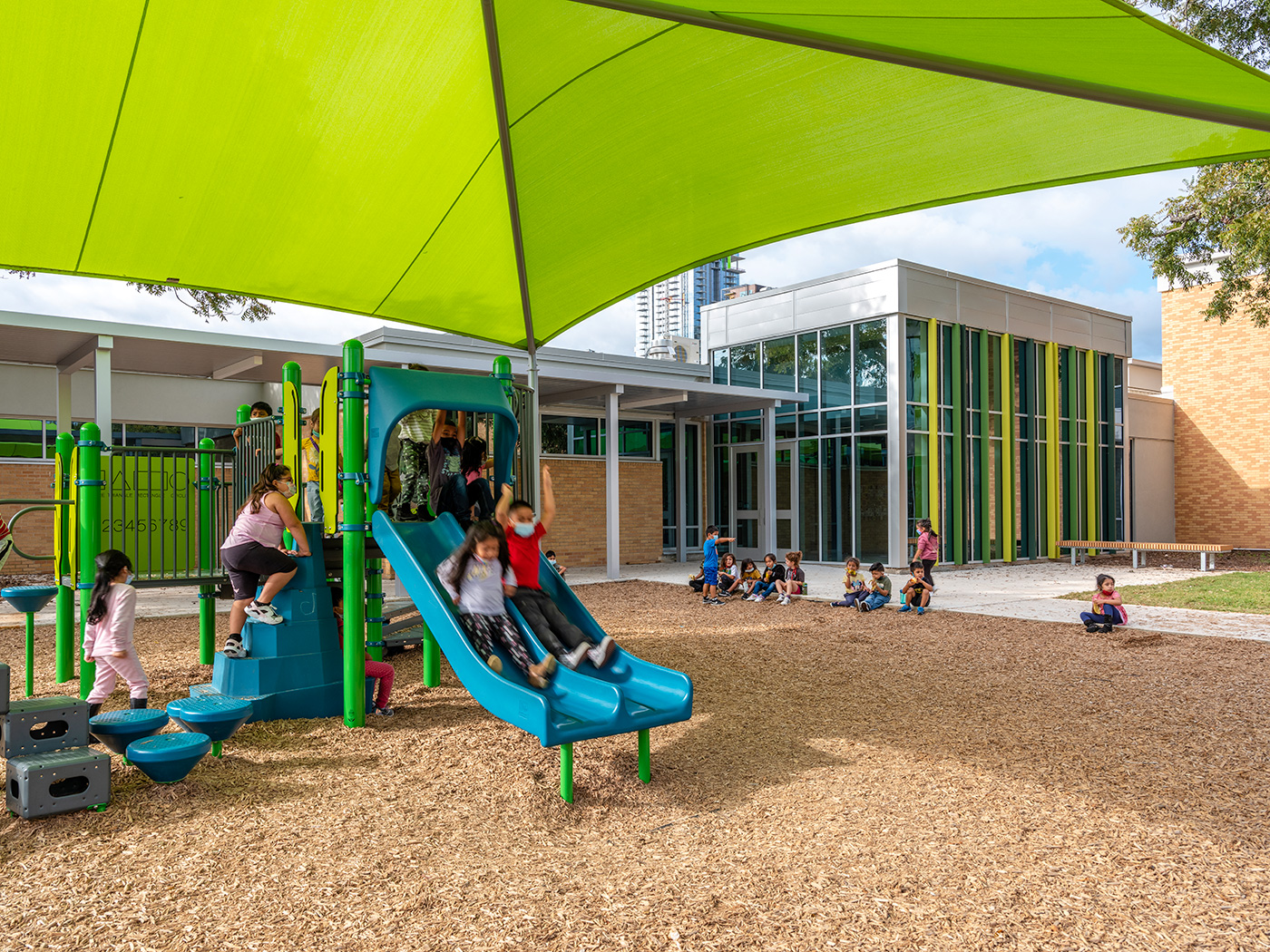 Kids playing in playground of an elementary school.