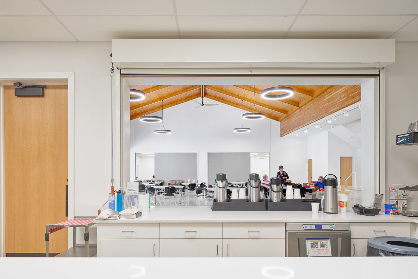 View of a dining area from the kitchen service window.