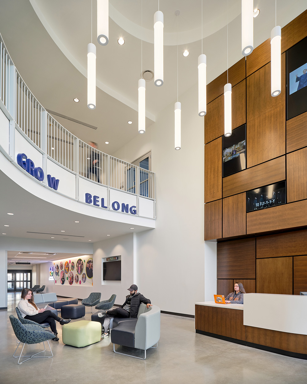 A lobby with a reception desk and seating area.