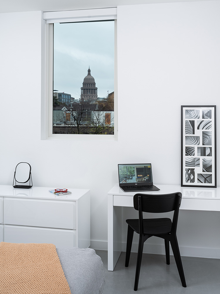 modern desk space in white bedroom.