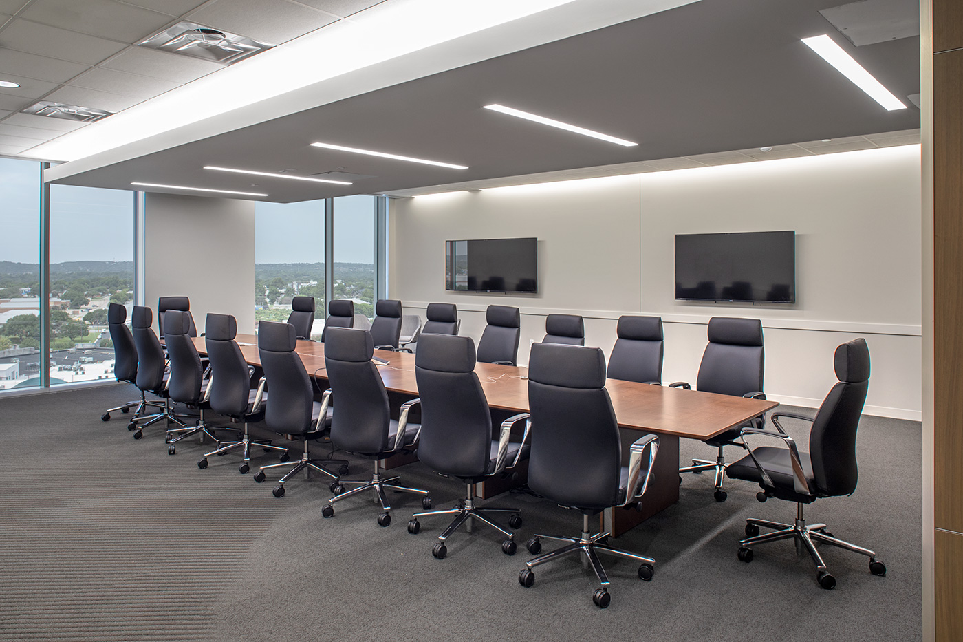 Large conference room with leather chairs.