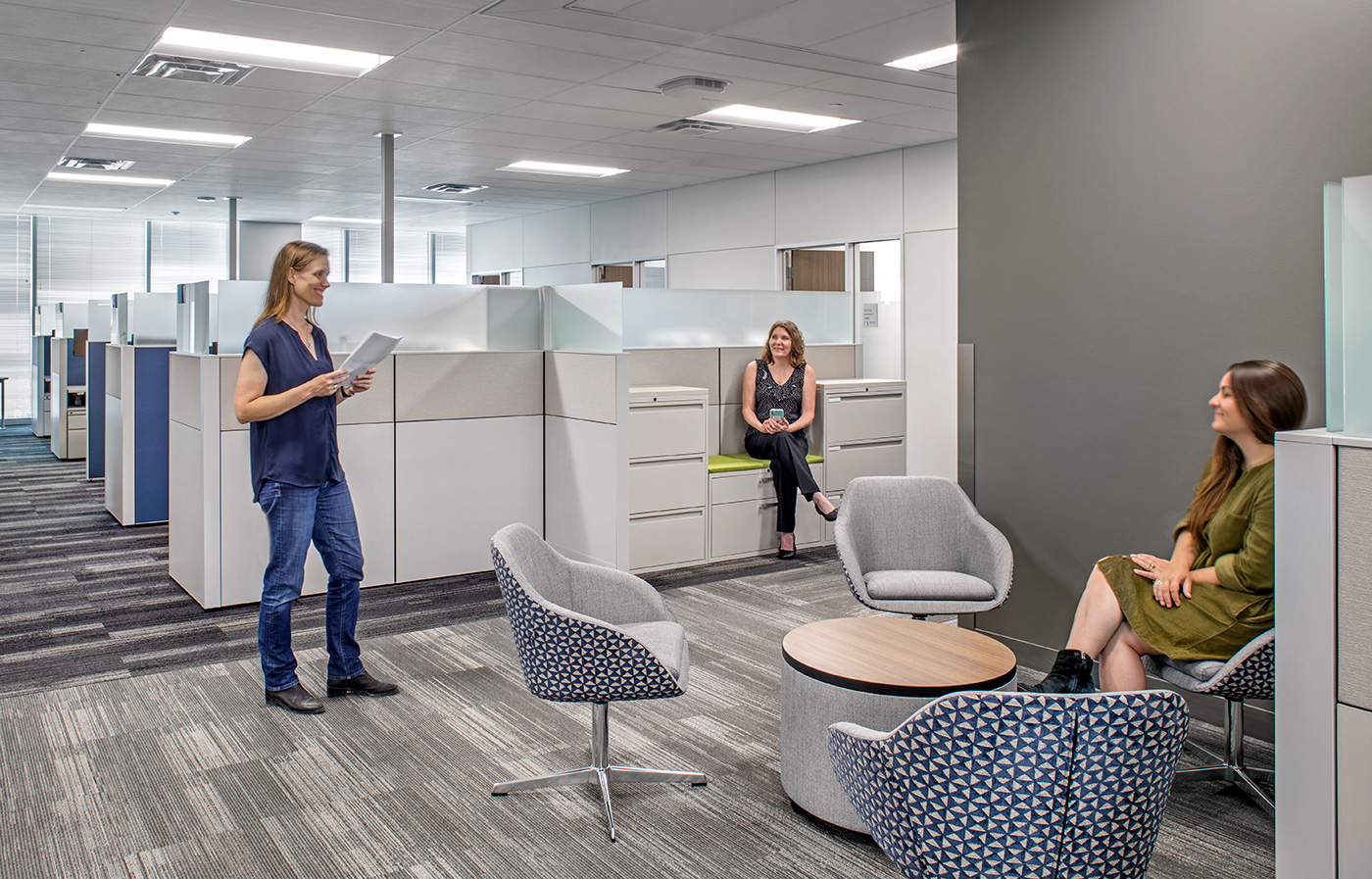 People sitting and talking in an office.