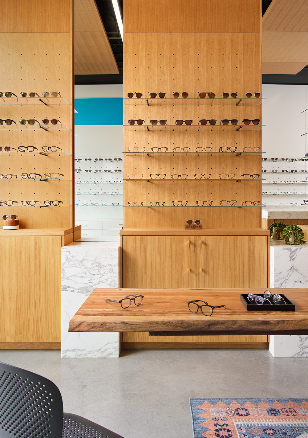 Glasses displayed on a wooden wall.