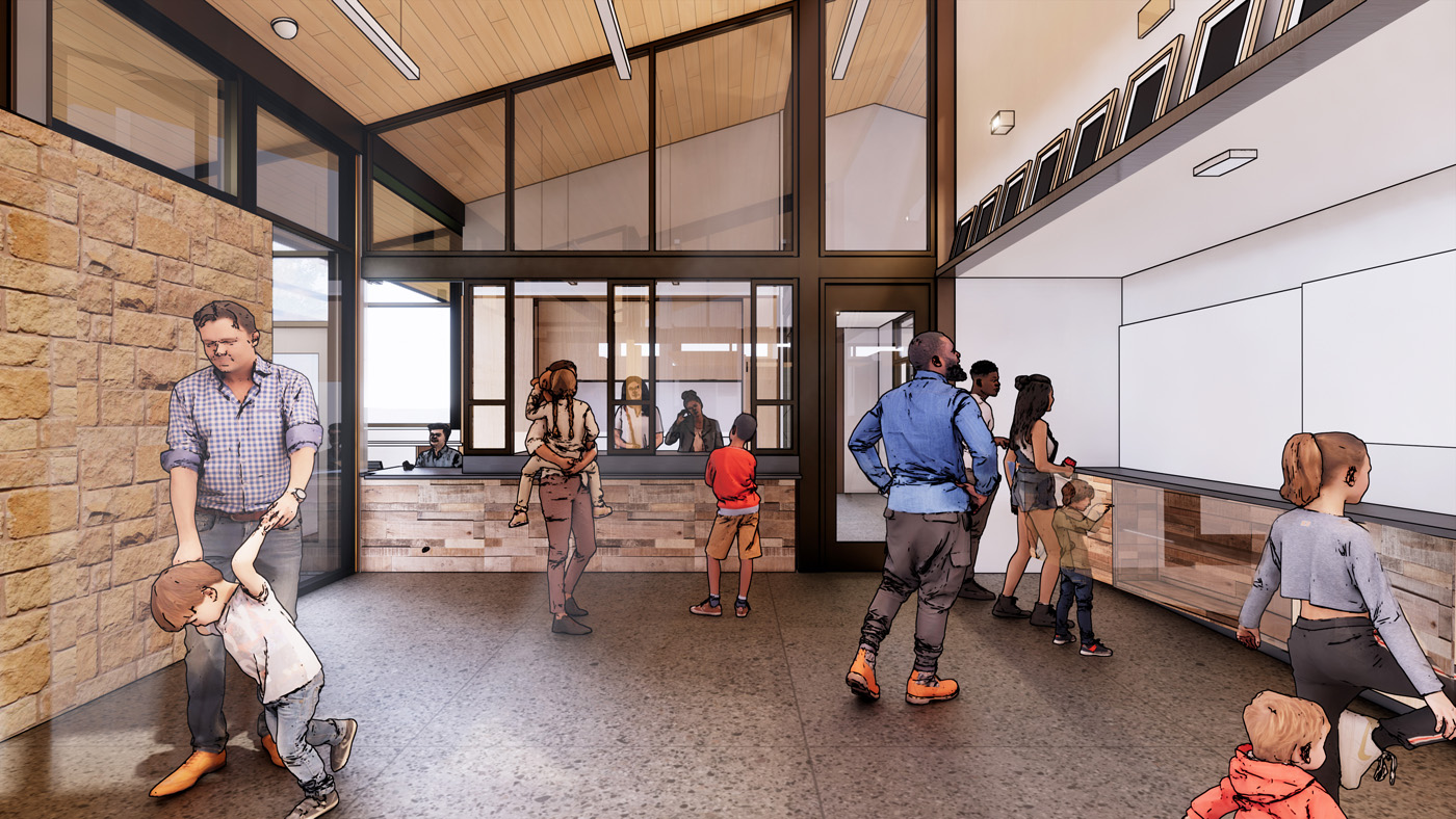 Families reading information on walls and taking to staff inside a visitor center.