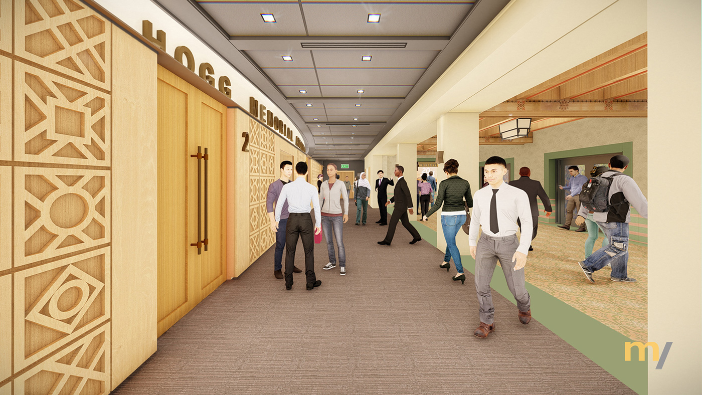 People walking outside of an auditorium's doors.
