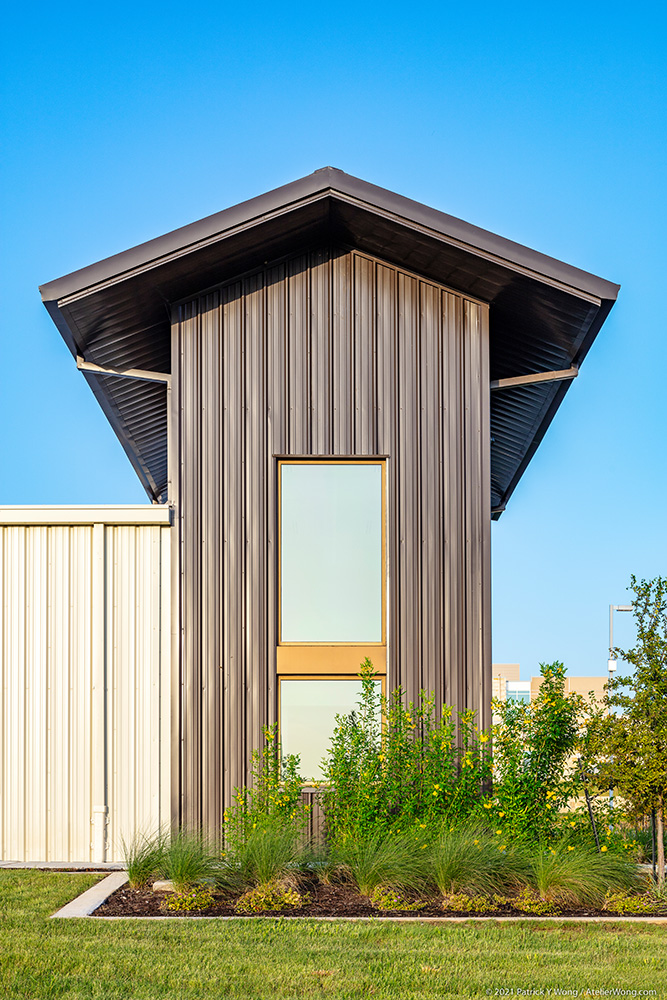 Symmetrical shot of a metal buildings awning.