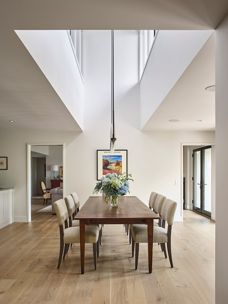 Dining table in clean home with bright natural light.